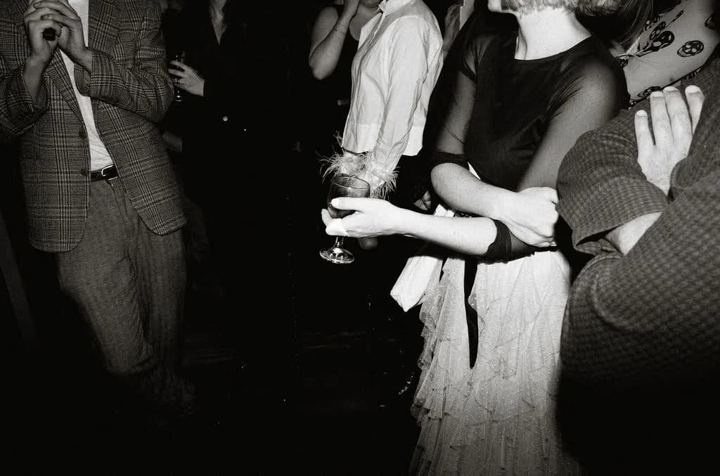 Guests enjoying drinks together at an evening celebration
